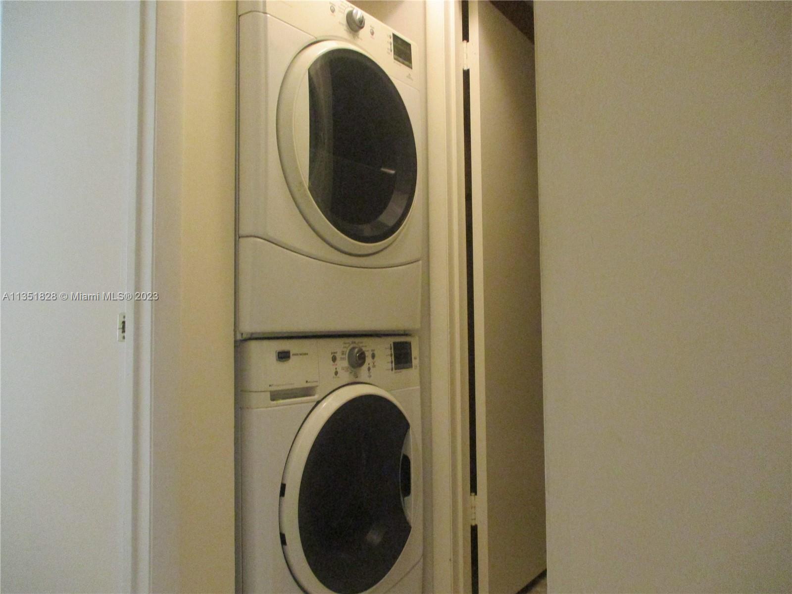 FULL SIZE STABLE WASHER & DRYER IN THE HALLWAY