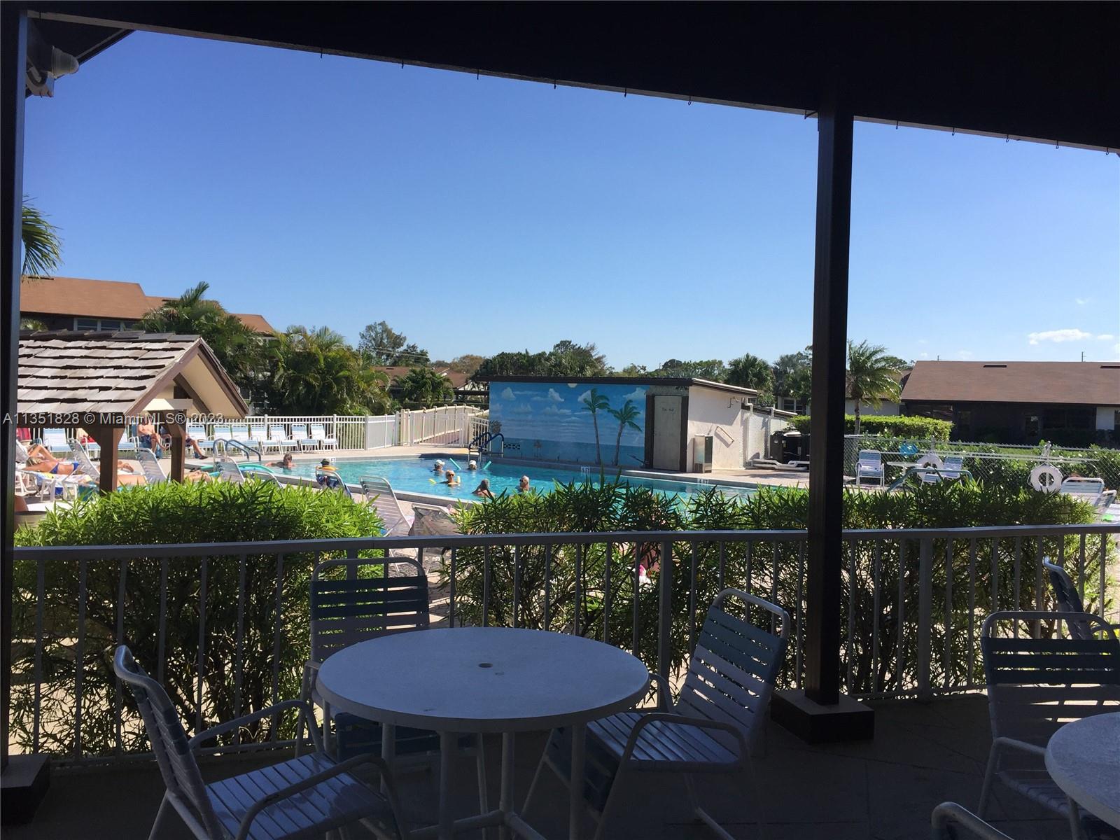 SHADES AREA OVERLOOKING POOL AND PICNIC AREA