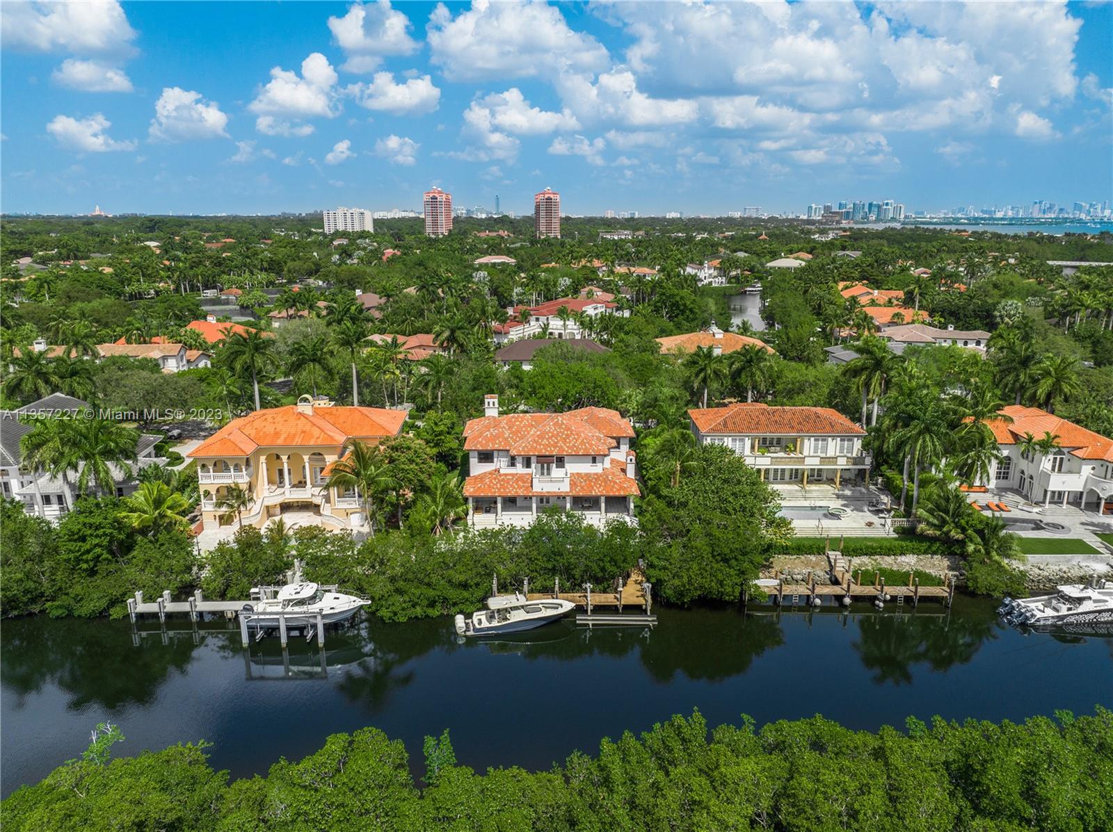 Located in the exclusive and Gated community of Islands of Cocoplum, This completely updated, contemporary waterfront home was exquisitely designed with great attention to detail. Featuring 6 bedrooms, 5.5 totally remodeled bathrooms, a brand new kitchen with top-of-the-line appliances and impact windows throughout. Fabulous custom bar with a wine cooler, ice maker, and tv.  Wonderful covered terrace and summer kitchen, perfect for entertaining. 100 ft of waterfront and 75 ft dock with lift with 20,000 lbs capacity. Enjoy 24/7 roaming patrol, tennis courts, beach volleyball, basketball courts, heated community pool, Gym, clubhouse, and kids playground. 24-hour notice to show by appointment only.