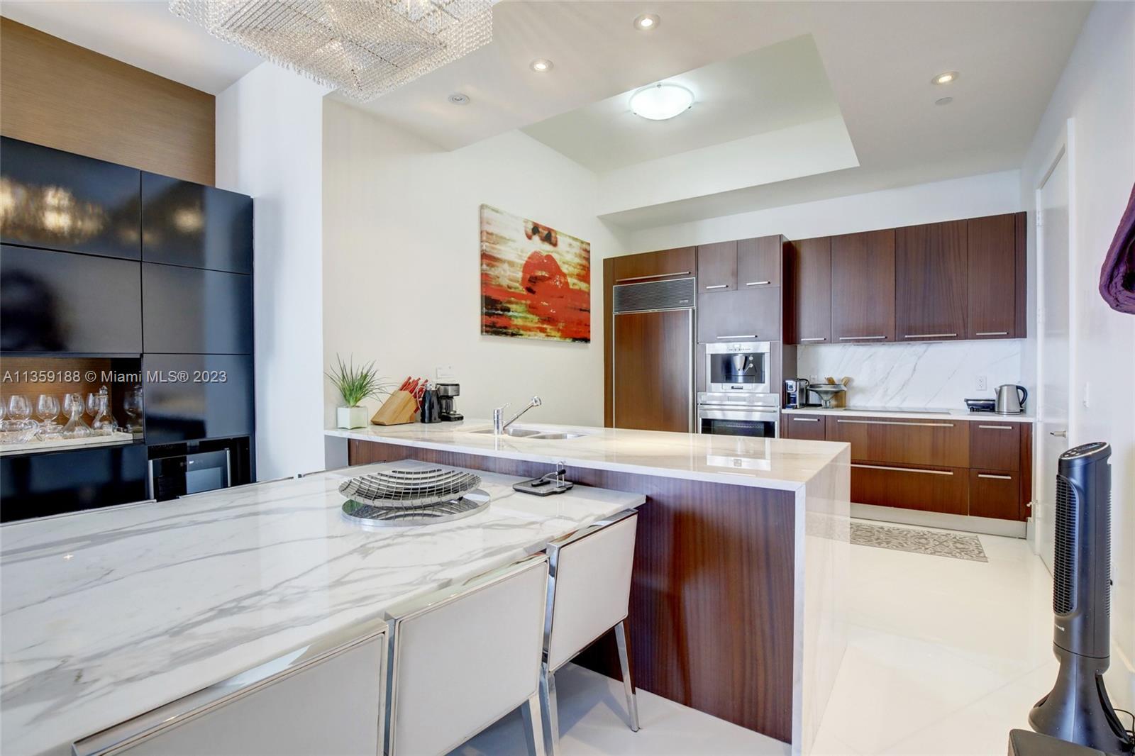 Marble Kitchen counter .Sub Zero Refrigerator, Built-in Cappuccino machine.