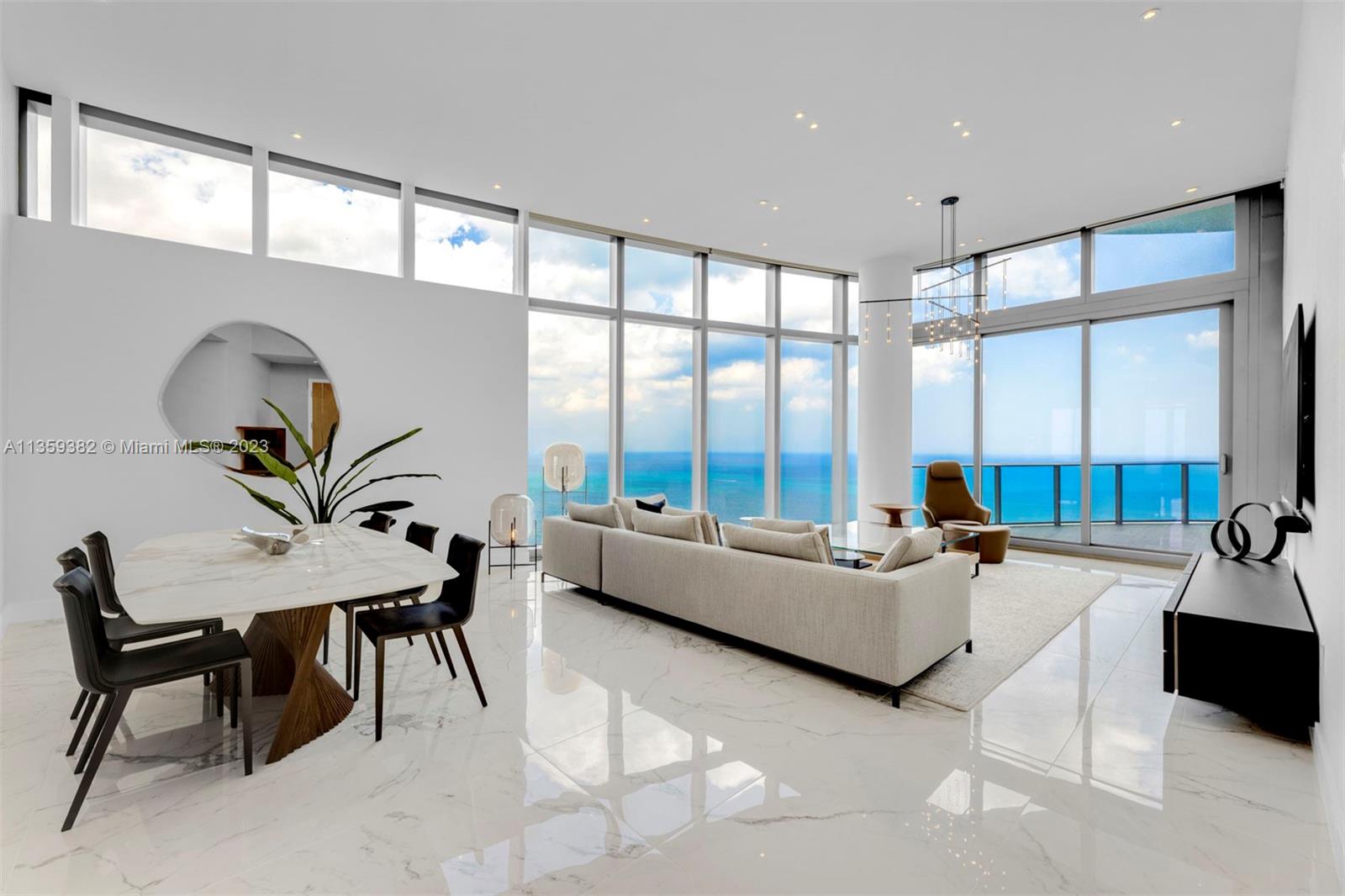 Sky Villa 4701 at Ritz Carlton Residences Sunny Isles redefines extraordinary. From the moment you step off the private elevator into this one-of-a-kind space in the sky, it’s easy to see just how far this residence has separated itself from anything else on the South Florida market. 13’ ceilings, floor-to-ceiling windows, panoramic ocean views and magnificent sunsets, two terraces, over 3,000 sq. ft. with 3 Bedrooms, 4.5 Bathrooms, Den, Marble Floor, and perched near the very top of the building, it is the tallest residence available in the building. Italian Gourmet Kitchen with Gaggenau appliances, Wine Cooler, and built-in Cappuccino maker, opens up to the oceanfront Dining Area and Living Room. Oceanfront Primary Suite. Primary Bathroom with Double Vanity and Rain Shower.