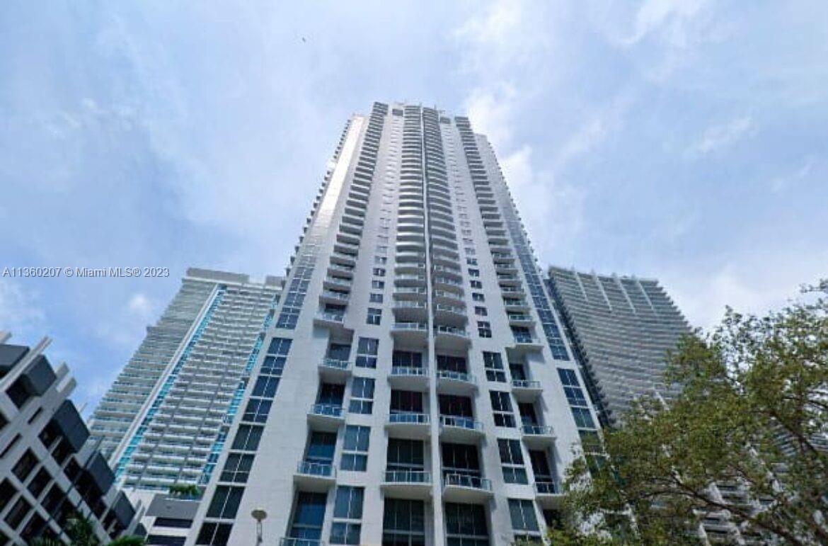 Spacious bi-level loft in the heart of Brickell. Enjoy great city life with views of the urban core of Miami's Brickell neighborhood. Two-floor unit with 18 foot ceilings, floor to ceiling windows, open L-style kitchen with Italian-style design cabinetry, one full bathroom with glass-enclosed shower and laundry closet downstairs, and open and spacious balcony overlooking the heart of it all. Amenities include assigned parking, 24hr security, concierge, front desk and valet, heated pool, fitness center, steam room, wine/cigar lounge, game room and party room; definitely one of the most full service buildings. Steps to Mary Brickell Village and Brickell City Center and brisk walk to 10th Street Station MetroMover; 20 minutes to South Beach and MIA. Live in the heart of Miami's Brickell.