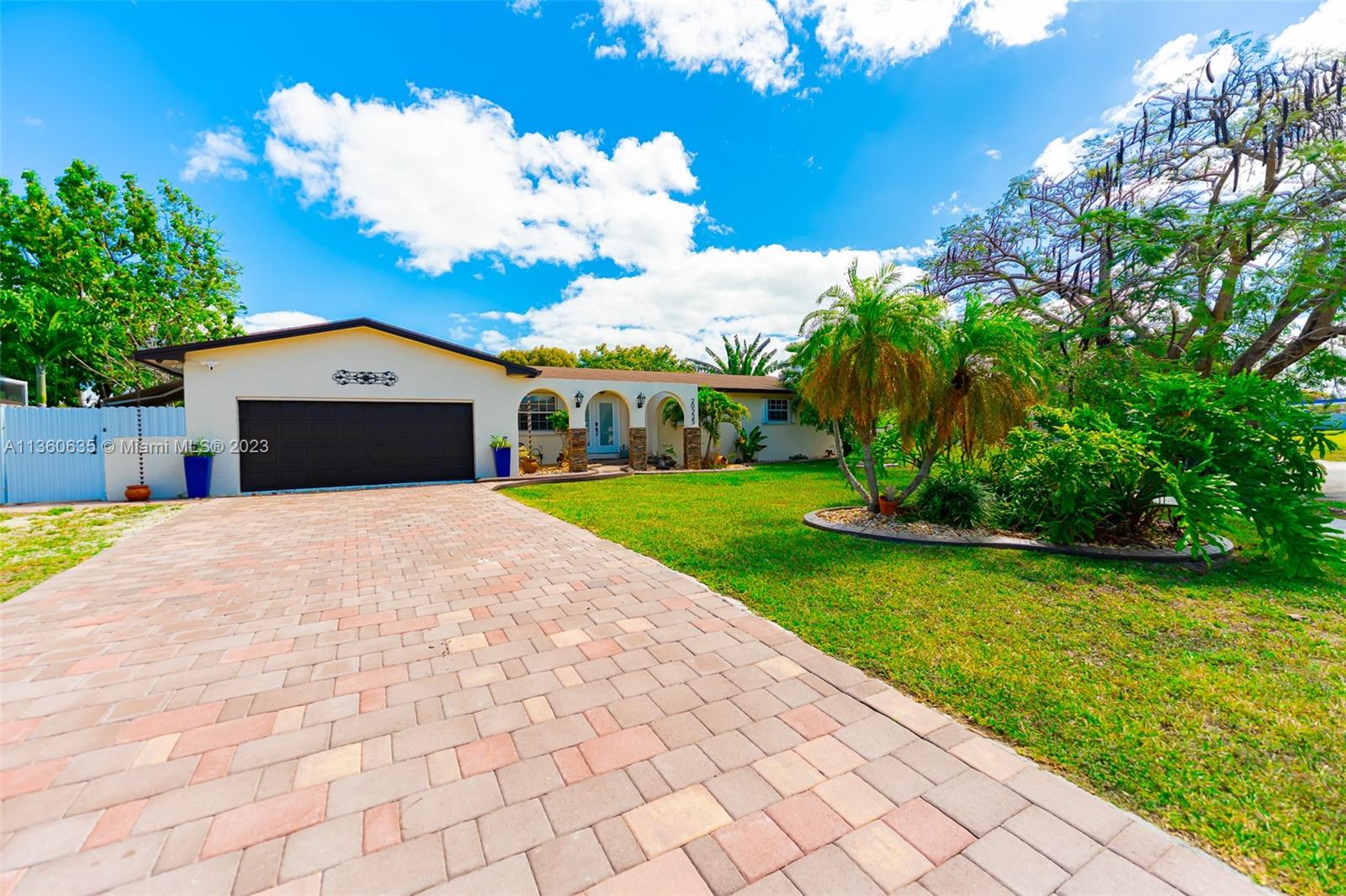 COMPLETELY UPDATED HOME and NO HOA!!!! Comfortable and Spacious 3/2 with car garage converted into studio, office and laundry room. Wood cabinetry, floating island and Hood system in kitchen, remodeled bathrooms. Tile floors 24x24 throughout, replaced windows and doors, impact front door and accordion shutters. 2016 AC w/ new conducts. Knock down texture on all walls and ceilings throughout, recessed lighting, nook bar, crown mold and base board 6’. Custom Landscaping features and paver on driveway.
Cozy entertaining area at back yard with above ground pool with wood deck, outdoor shower, barbecue, sink. 12x12 wood pergola, covered patio, shed.
This Home is conveniently located minutes away from Florida Turnpike, east of us1 and Old Cutler Road, shopping centers, Restaurants. Must see.