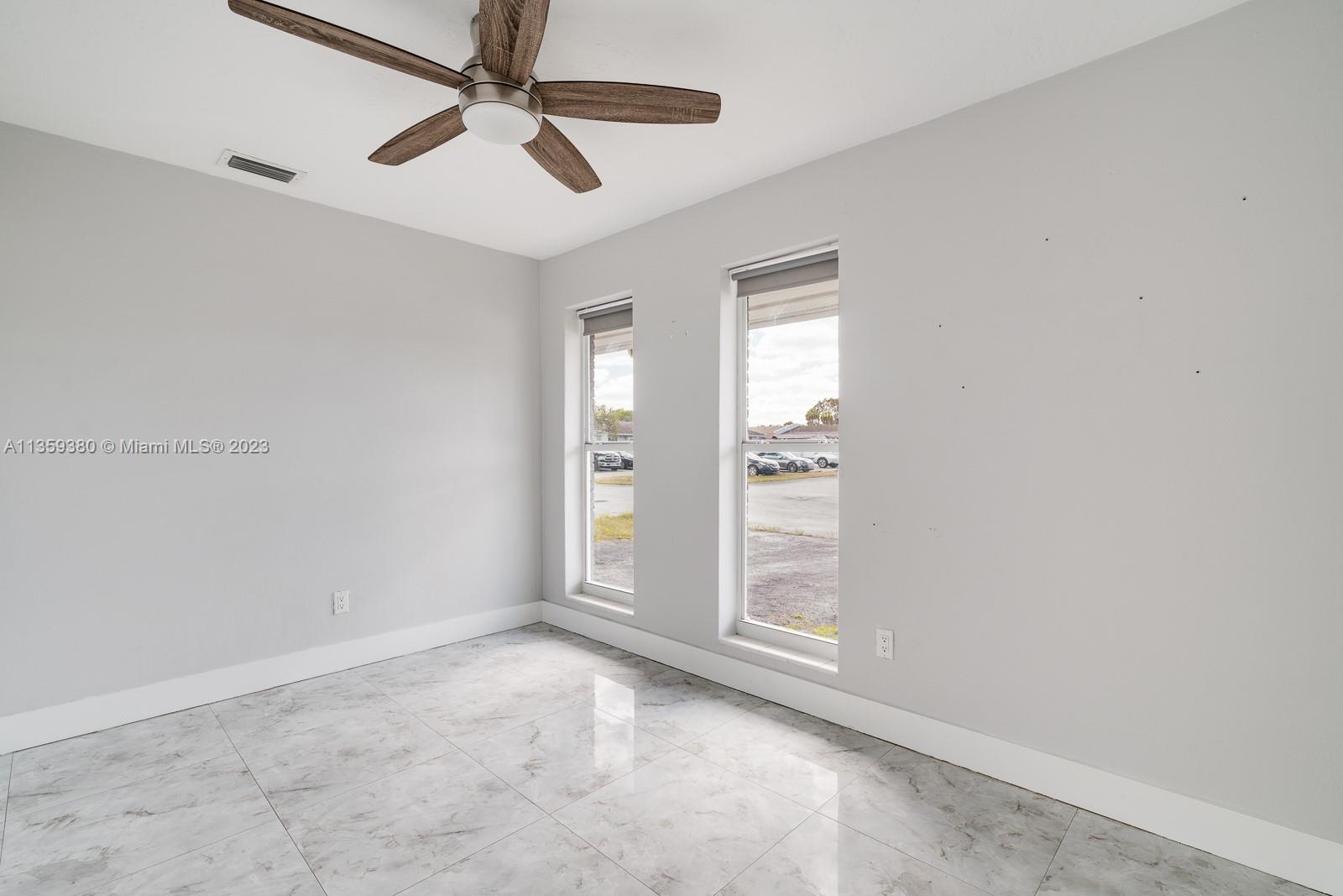 This is the second bedroom located in the North West corner of the unit with 2 windows, a nice fan with a remote and a closet with built-ins.