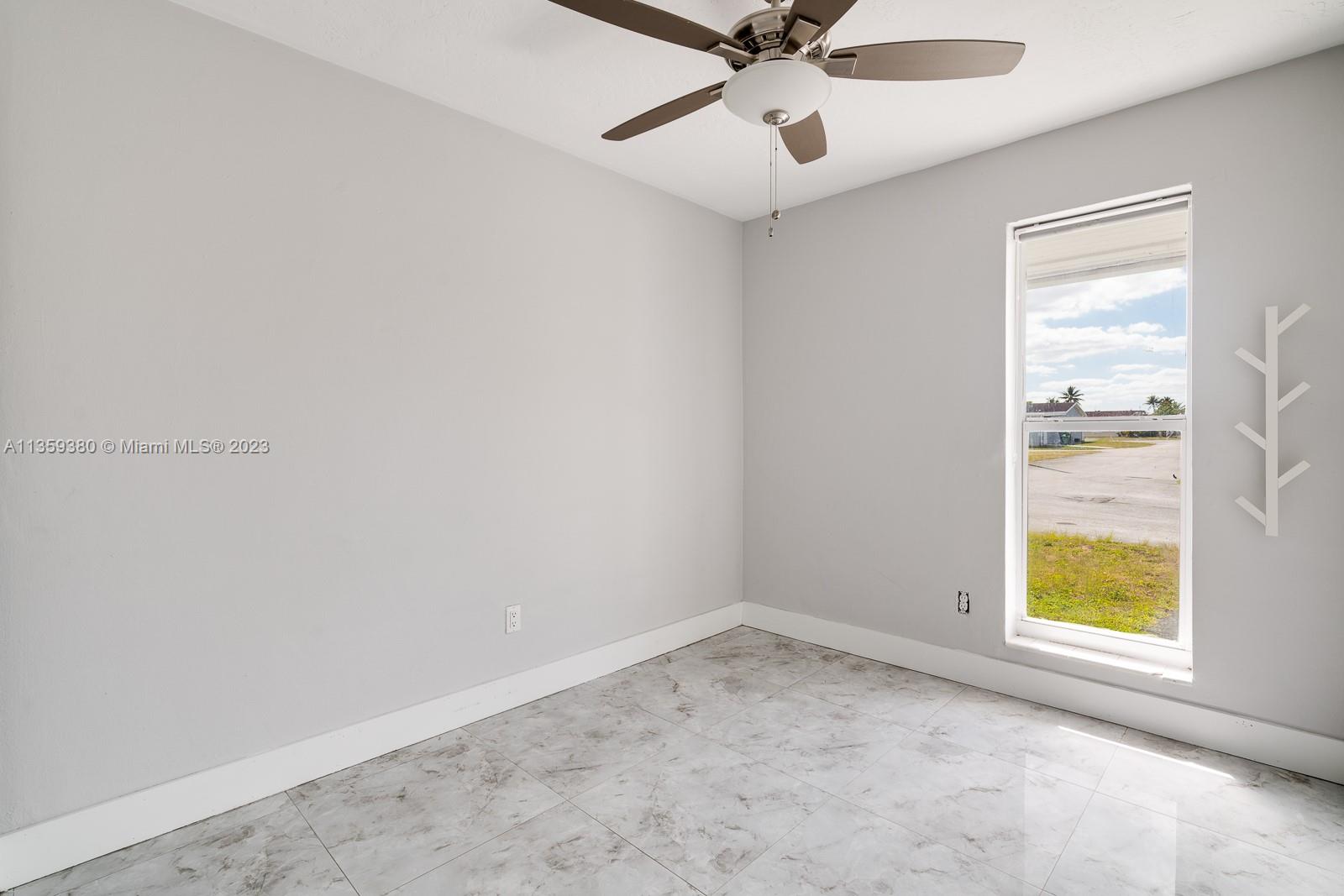 This is the 3rd Bedroom is the SW corner of the unit and has 1 window and the fan with a remote and the closet also has the the closet built-in shelving!