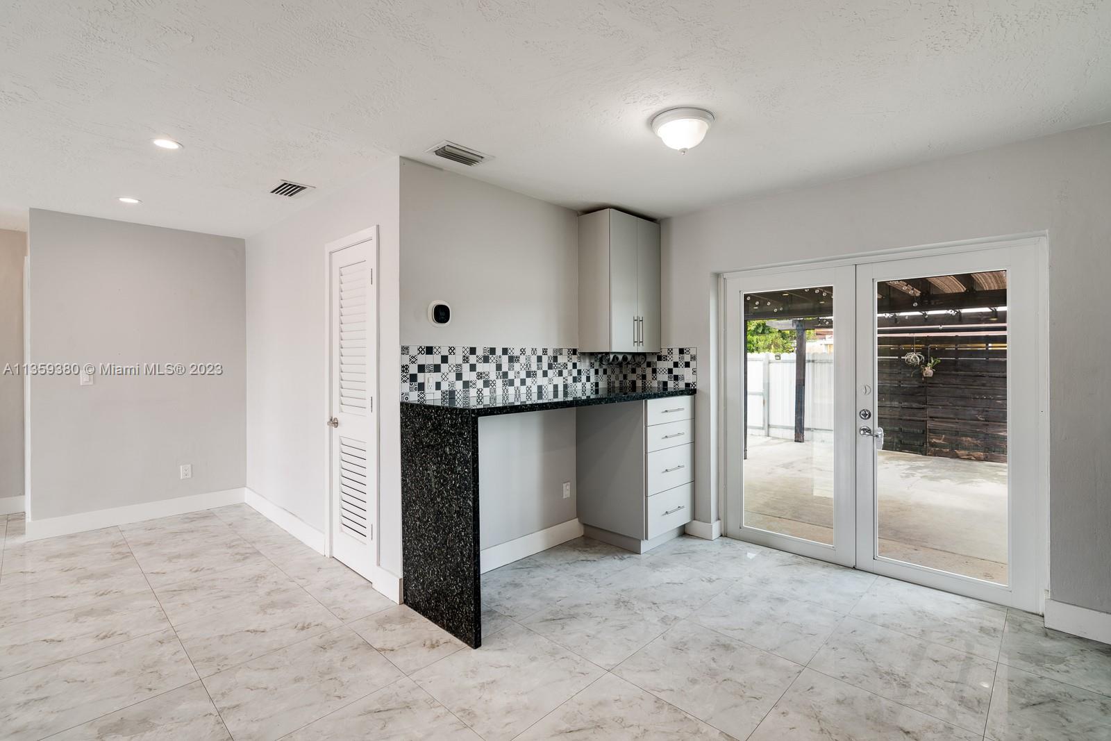 Here is another view of the North wall of the kitchen, the Impact French Doors and where the proximity of the diningroom area to the kitchen.