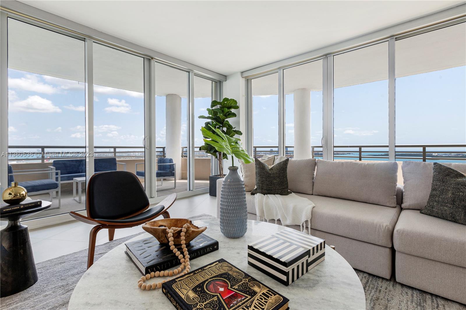 Panoramic views of Biscayne Bay and the Miami skyline await at this large, high-floor, 3-bed + den condo with deep shaded balconies on gated Brickell Key. Interiors have been renovated with porcelain flooring, giving the space a luxurious & modern feel. The open kitchen, which overlooks a spacious and inviting living area, has been tastefully updated with state-of-the-art appliances and stunning finishes. Tequesta III is a 46-story tower, built in 2001, where you’ll find everything you need to live the quintessential Miami lifestyle, just 1/2 mile from the heart of the financial district. Residents enjoy world-class amenities, including a fully-equipped 2-story fitness center, tennis, basketball, racquetball, pool, BBQ area, and business center, plus 24-hour concierge & security services.
