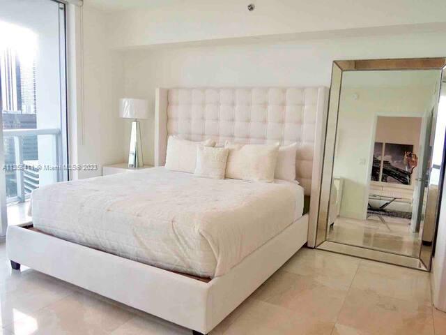 This 2-bedroom, 1-bathroom unit on the 22th floor boasts stunning bay and Brickell Ave views. The interior features beautiful marble floors, top-of-the-line Wolf kitchen appliances, Italian kitchen cabinetry, and floor-to-ceiling windows that flood the space with natural light. The unit comes fully furnished and ready to make money from day 1.

Residents will have access to state-of-the-art amenities, including a 2-acre pool deck with three infinity-edge pools, one of which is Olympic-sized. There are also five on-site restaurants, including the Cipriani restaurant and Icon Cafe at the pool. Additionally, there is 24-hour valet and front desk service, and the W Hotel Spa and fitness center are available for use.