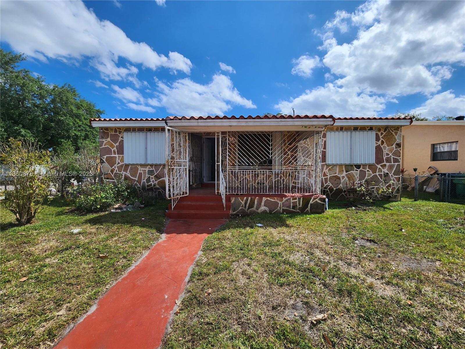 Investor Special! 2 bedrooms, 1 bath, spacious one-story corner unit. Tile Floors throughout, Central A/C, and Lots of Light. Accordion Hurricane Shutters. Needs TLC - Property Sold AS IS. Delicious Mango & Avocado trees! Easy to Show!
