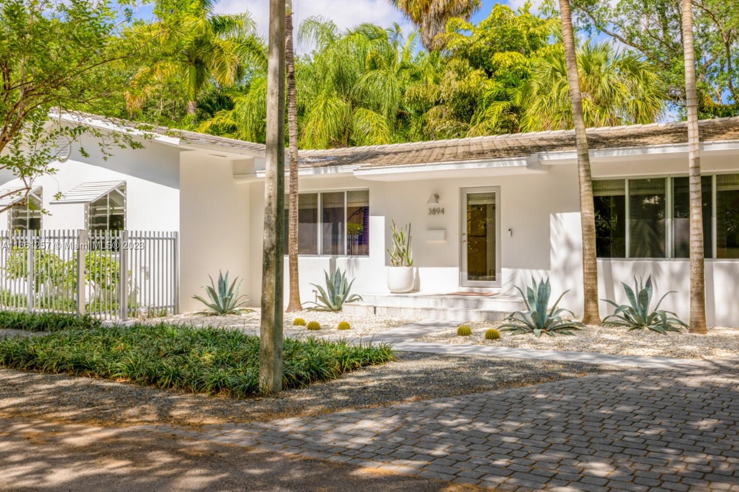 Lovely home on a great street in lush, tree-canopied S. Coconut Grove. Walk to the Grove villages galleries, boutiques, cafes and bayfront parks & marinas. Recently updated including roof & impact glass throughout. Light-filled living spaces w/ wood floors and high ceilings, overlook the covered patio for year-round outdoor entertaining. Large master suite has walk-in closet, modern-style bath w/oversized shower and French doors opening to the garden. Euro-style kitchen features Italian teak cabinetry, stainless steel counter-tops & breakfast bar. Light-filled family room w/ wood floors & 10 ft ceilings, overlooks the covered patio for outdoor entertaining. Not in a flood zone. Just mins to highly rated schools & to shopping & dining in South Miami & Coral Gables.