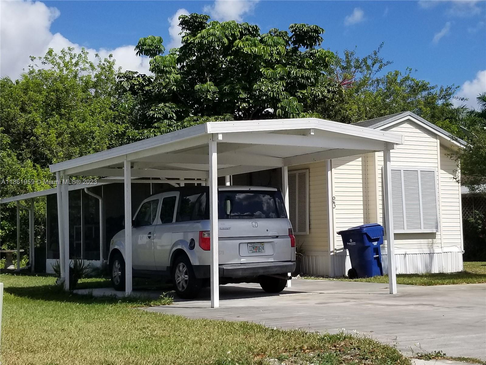 Beautiful 1 Bedroom one bathroom manufactured home with land. With screened in patio, carport and shed. In a gated community, with a community pool area. Property is well kept. Within 20 to 25 minutes from the Florida Keys and close to the Turnpike. Close to shopping centers, restaurants and moore. A must see.