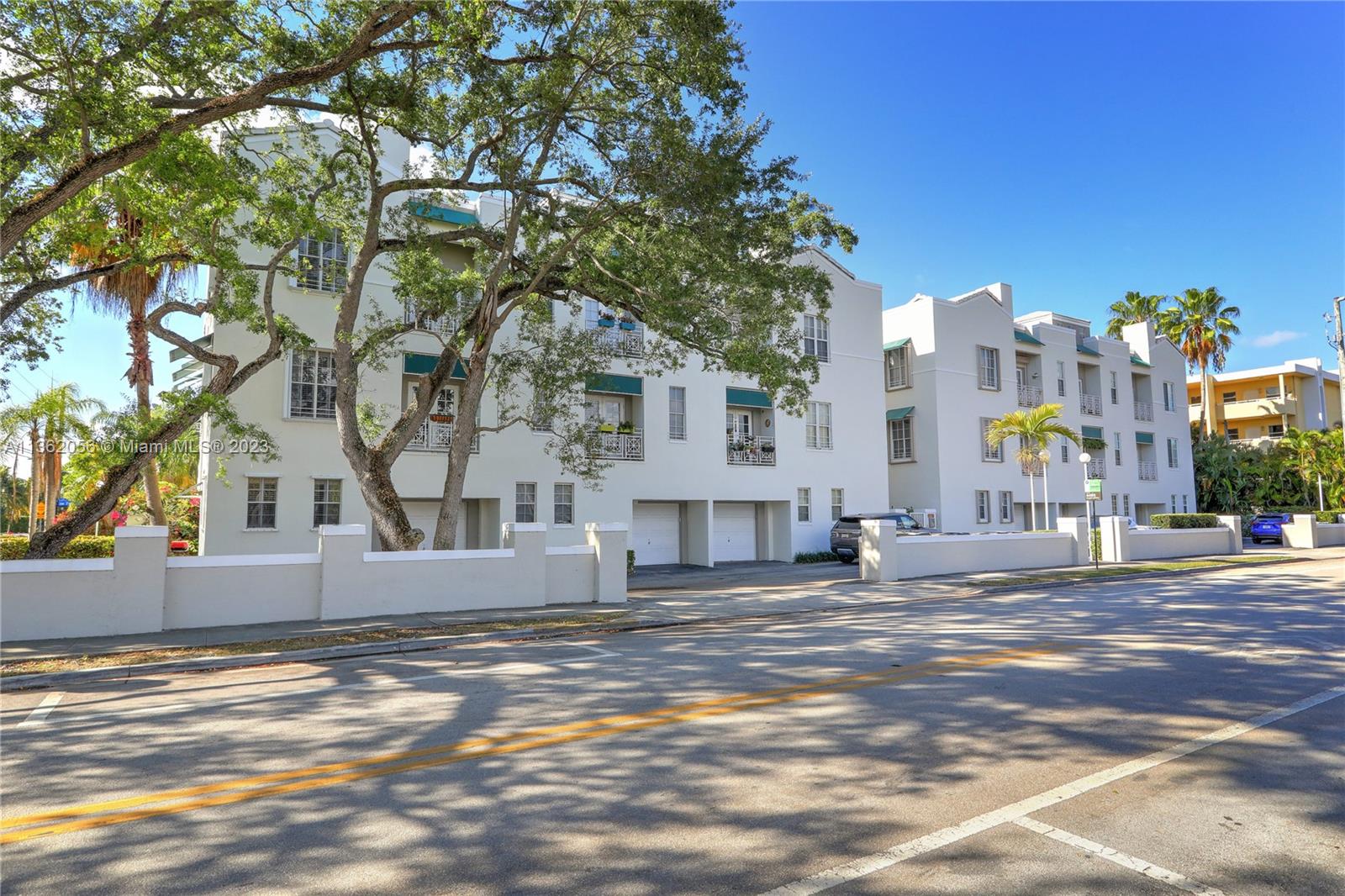 Walk a few steps from this gated, two-story townhouse to see a movie at Sunset Place and have dinner in one of the many South Miami restaurants. This 2 bedroom, 2.5 bath home is accessible by private staircase and located in the middle of the Fountains 14-unit community. The unit has ceramic tile floors, plenty of natural light, and garden views from every French door and window. The first level includes a family room, living room, granite kitchen, pantry, and half bath. The second-floor features cathedral ceilings with skylights, the primary bedroom, guest bedroom, and washer/dryer. The parking area for this unit can fit 3+ cars. It has been freshly painted and is ready for new residents! Easily rented for investors too.