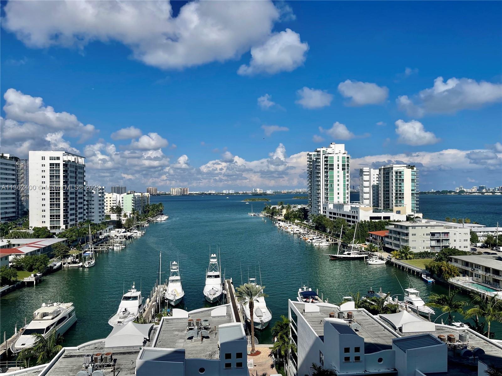 Best condo in the building on 10th floor has amazing bay views from every room. Best location facing north with provides a cool breeze all year long. Fully furnished and fully equipped, this gorgeous condo is ready to move in. Water, cable and wi-fi is included in rent, 1 covered parking space assigned & free valet for guests.  Two bedrooms, two bathrooms, built in closets, porcelanosa floors; newer appliances including washer and dryer in unit and large and private balcony.  Building amenities include a fitness center, two pools, clubhouse, hot tub, concierge services; 24 hr doorman and package service, security and marina (docks available for rent). No pets allowed. Available for annual lease or 6 months.  Condo approval needed.