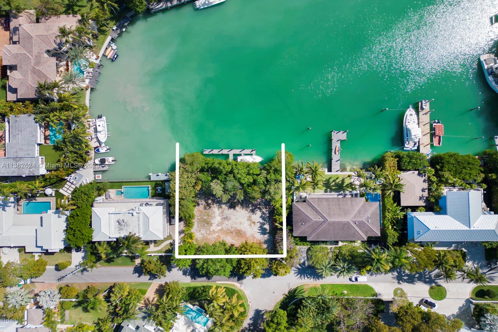 Waterfront Lot ready to build.  .25 of an acre with brand new dock.   Can fit up to a 105 Ft Vessel.  Only vacant lot available on Key Biscayne.  Tucked away inside highly desirable hurricane harbor with deep water, very protected, and wide lagoon views makes this is true boaters paradise.  Combine that with building your dream house makes this unique opportunity a reality for your pickiest end user and/or investor alike.  Easy to show.