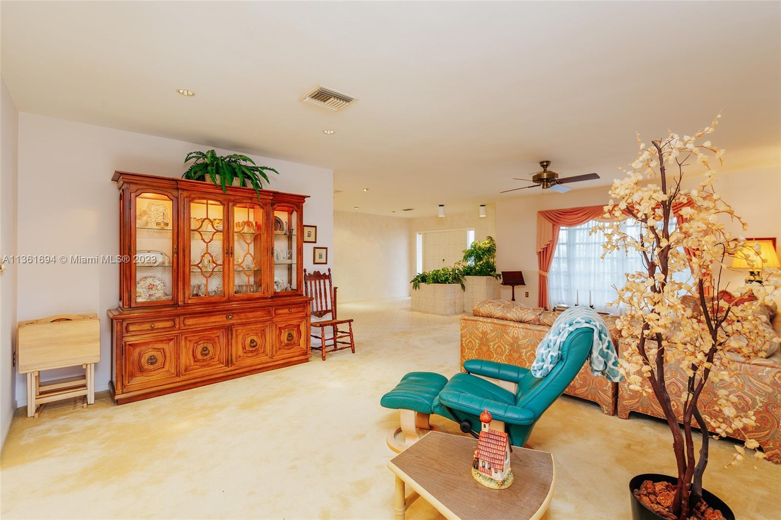 Living Room looking onto bay window and foyer area