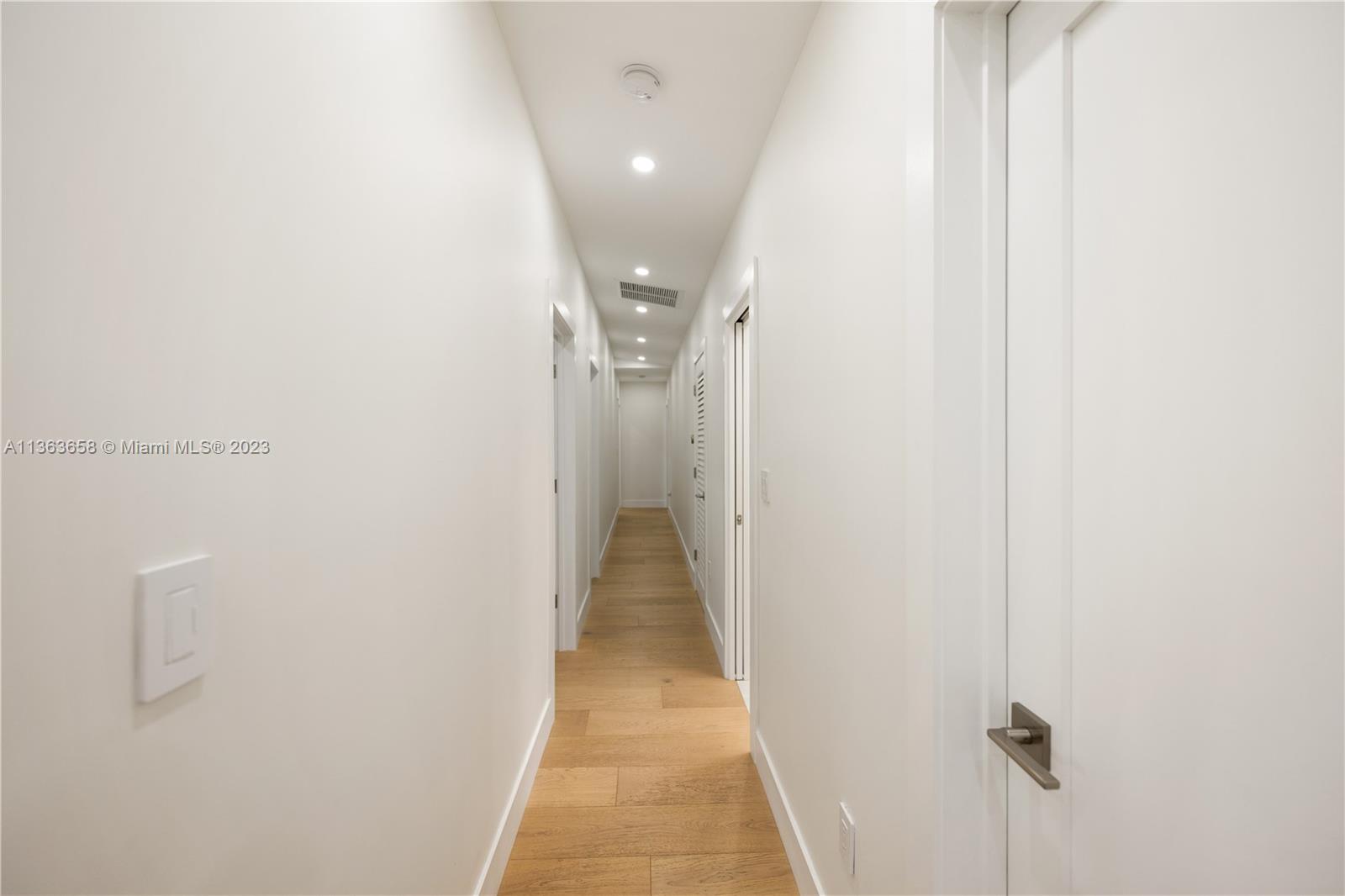 Hallway to guest/cabana bathroom and all 4 bedrooms