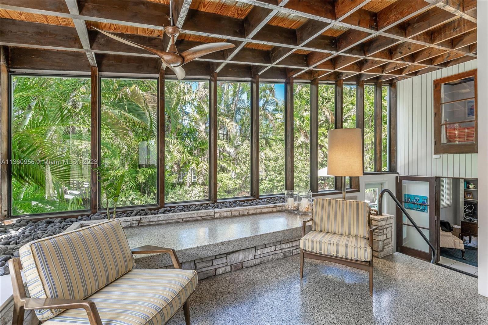 Gorgeous floor to ceiling windows line almost the entire home.