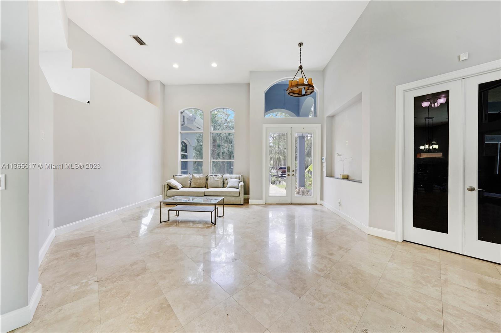 Front Entrance Living room View with Media Room Entry on the Right side