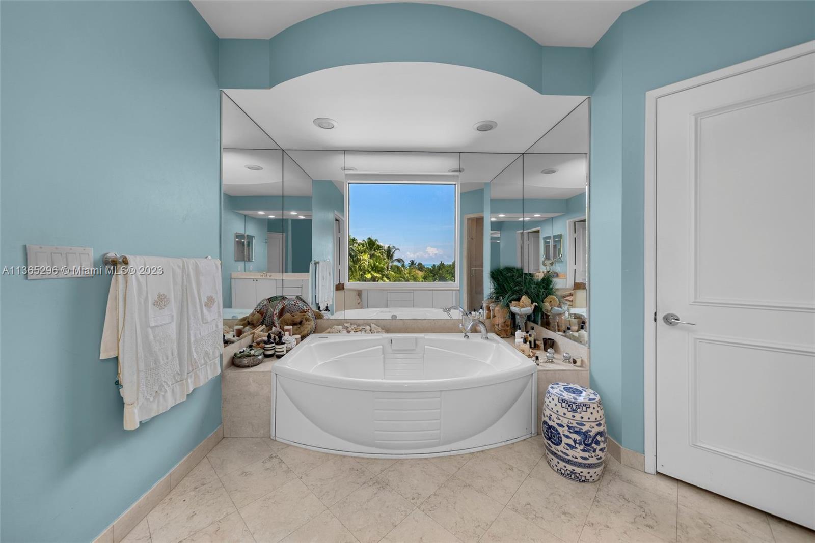 Master bath with separate shower and whirlpool tub.