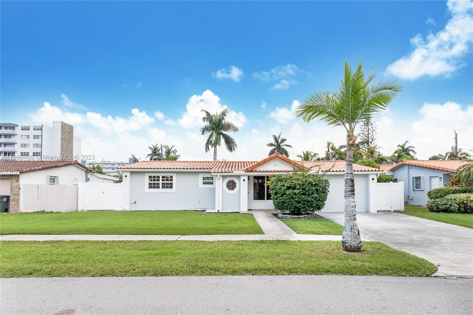 Rare Find! Immaculate condition, spacious and bright home ideally located in NE Hallandale Beach. Rooms galore! Home features include 3 bedrooms & 3 bathrooms, can be used like a 5-bedroom, formal dining & living room, open kitchen, oversized Florida room, large master suite with bonus room attached. Tile flooring throughout, external storage shed, new roof & A/C, Impact windows throughout, gas generator on site, room for pool & boat storage. Great for entertaining or hosting large families.  Five minutes to beach, airports, malls and shopping centers. The spaciousness of this home is unparalleled and must be seen - won't last!