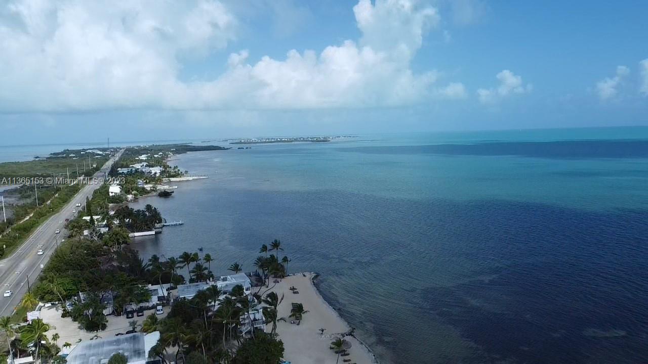 Attention Developer/Investors. This OCEANFRONT LOT has a KEYWEP score of 1.63 far below the maximum score of 5.5 required by the City of Marathon to allow development. New Owner can request abandonment of the existing right of way and add an additional 30' deep x 60' wide area from the City of Marathon near overseas highway increasing the depth of the lot. Flexible MU Zoning allows for a variety of uses including multi tenant development and transient lodging and other uses. Neighboring properties are classified by the Property Appraiser as "Multi Family View" which Multimillion Dollar Properties! Rare opportunity to get a chance to own an ocean front parcel at a fraction of the price of the homes in this desired area. Survey and KEYWEP in hand. Buyer confirm all information. Owner/Agent.