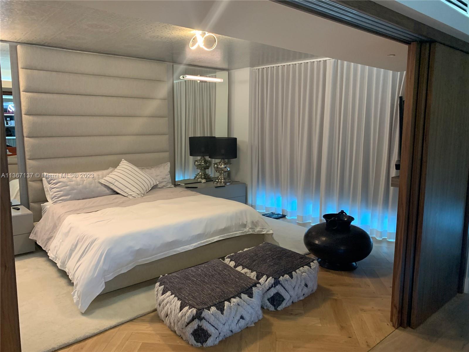 Master Bedroom with Japanese walnut wood hanging doors fully opened.