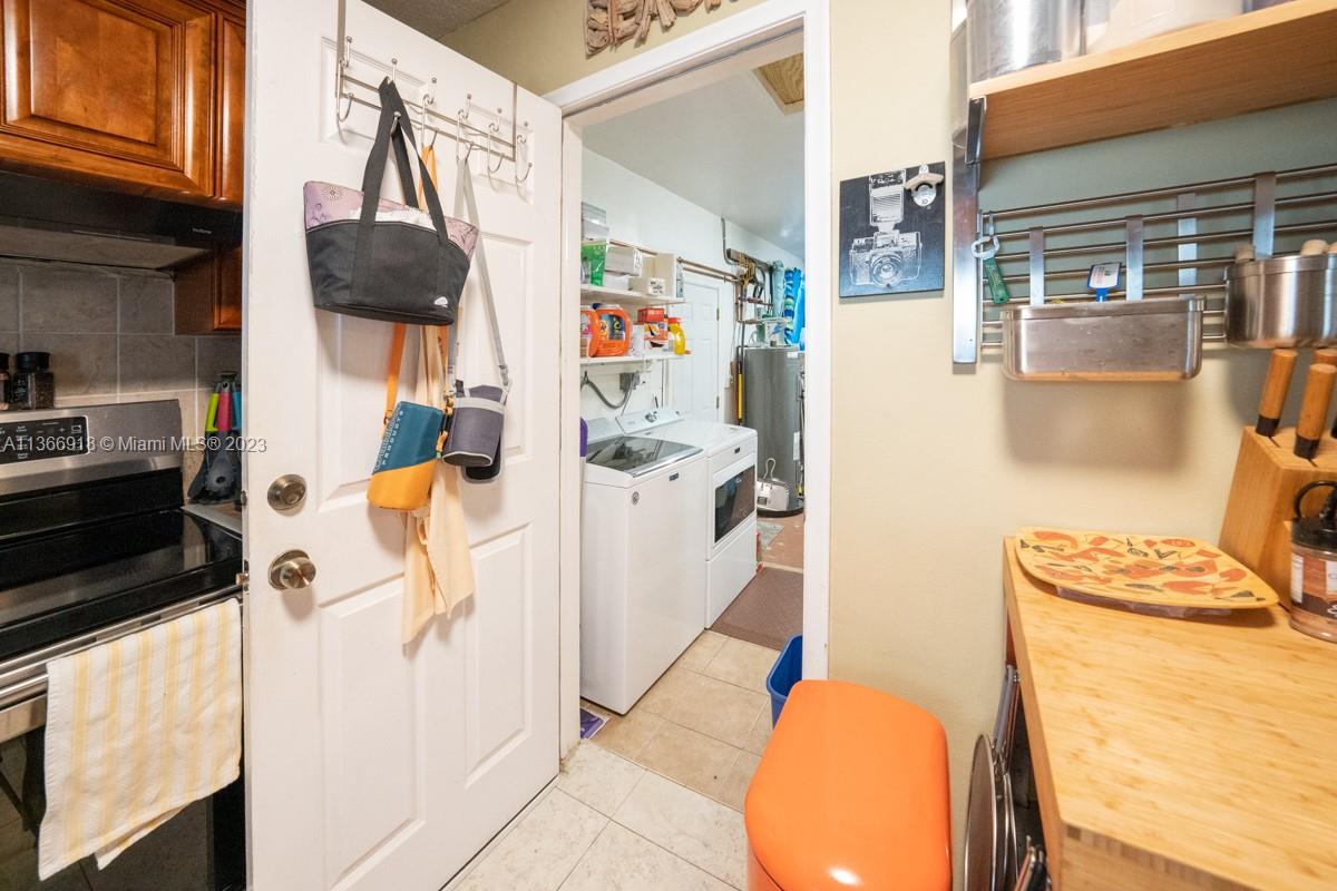 Enter garage through kitchen.  Garage also has private entrance pictured here past the washer/dryer.