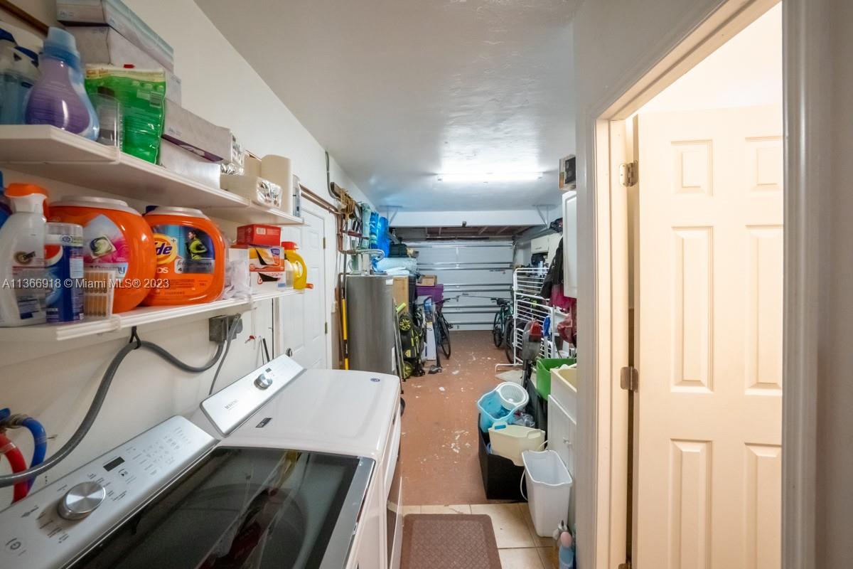 Full-size excellent Maytag washer/dryer under warranty  2019 Water heater.  Lawn equipment and generator can stay.  Separate entrance into garage.  Full bathroom on right.  Easy to convert garage.