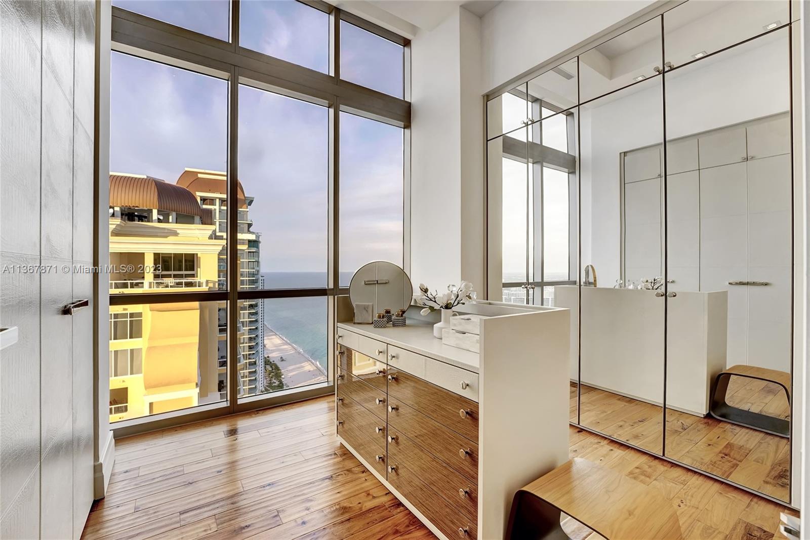 Ladies closet with jewelry area and custom shelving. Who wouldn't love these views?