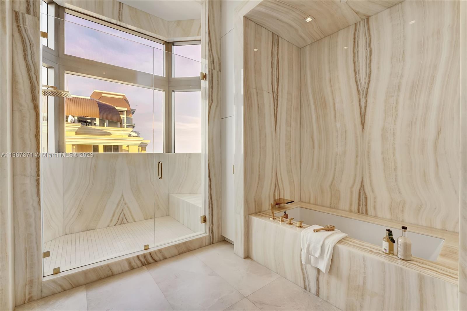One of two luxurious master bathrooms - his and hers, of course.