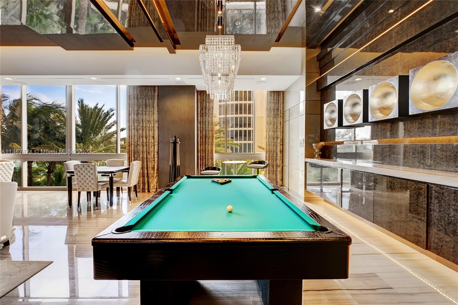 Owners private entertaining room with a piano, billiard area and wine room.