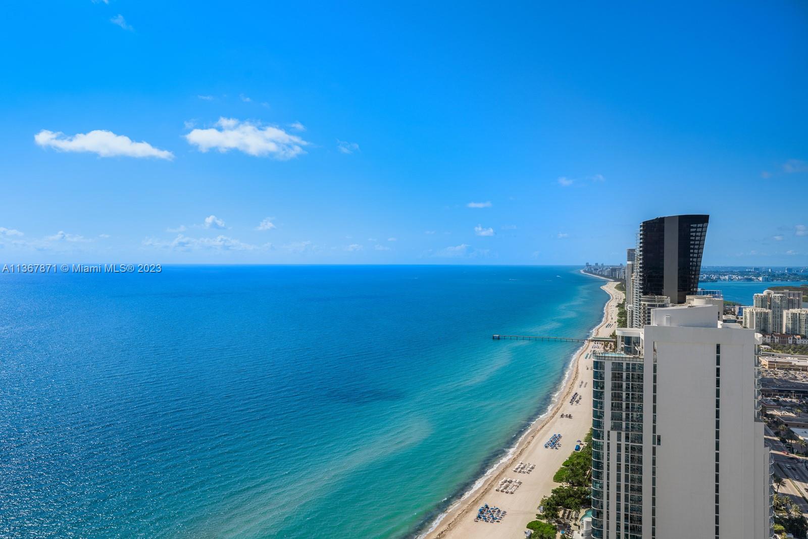 Front terrace view facing south spans all the way to Miami's skyline with stunning colors at sunrise and sunset.