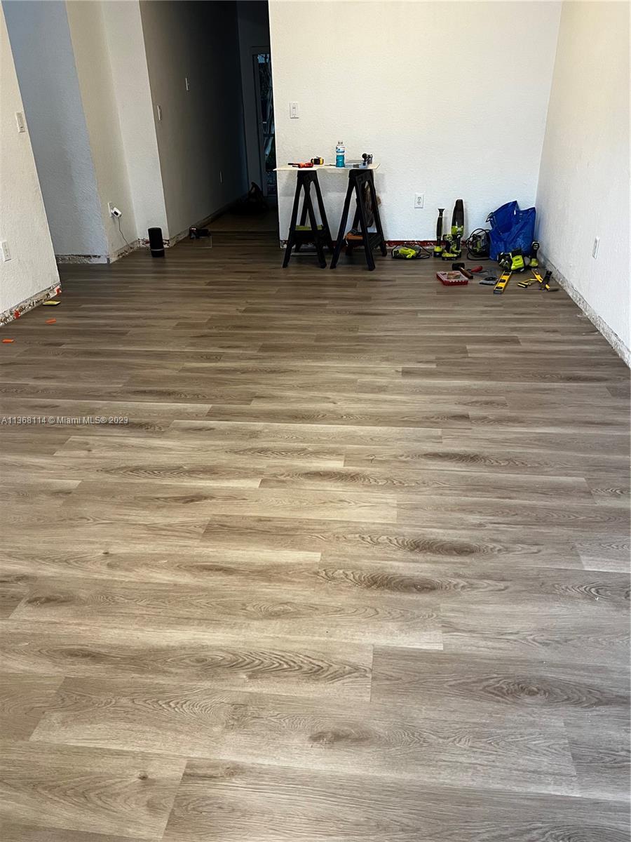 New floors and baseboards throughout the unit