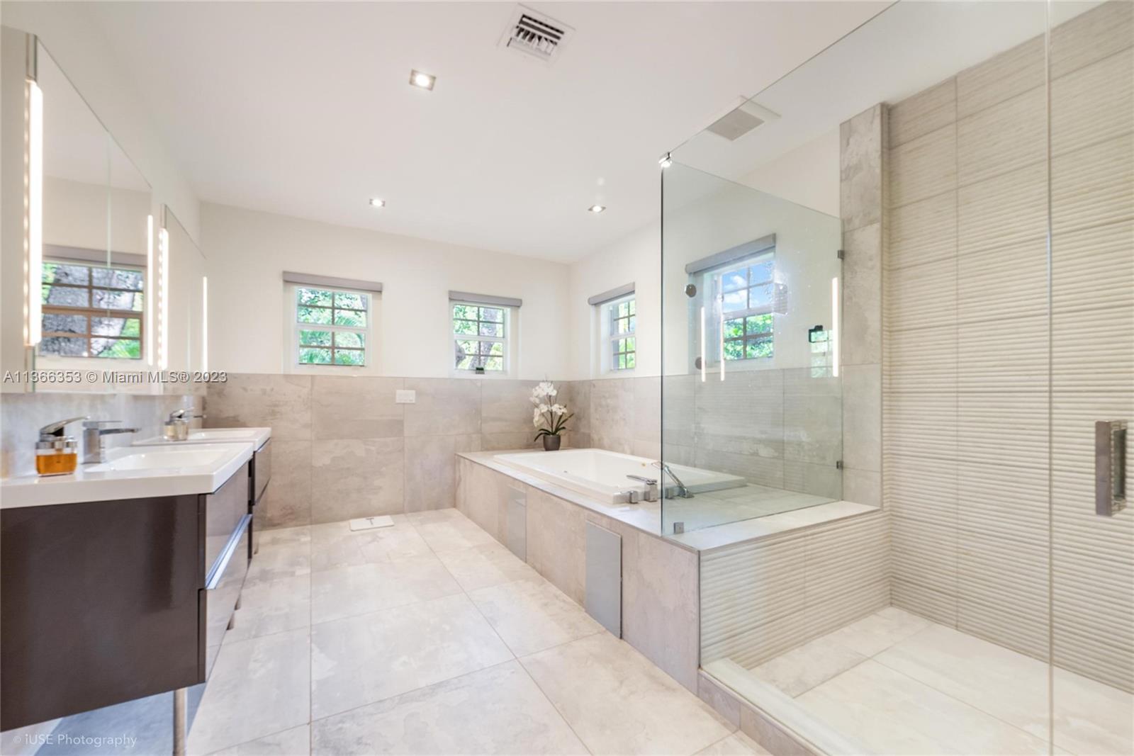 Bath and shower in well appointed master bath