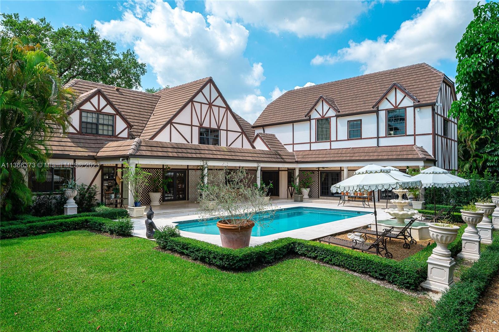Beautiful 6 bedroom / 4.5 bathroom traditional two story Tudor style home located in private Pine Bay Estates community in the Gables. This property was recently upgraded and features marble floors throughout, walk-in closets in all bedrooms, spacious kitchen with state of the art appliances including a gas range stove. A stunning and spacious grand salon with high ceilings and crown moldings opens up to the outdoor space making it perfect for entertaining. Manicured English gardens with potager, fountains and a covered patio. Brand new generator, 2 car garage and full security system.
