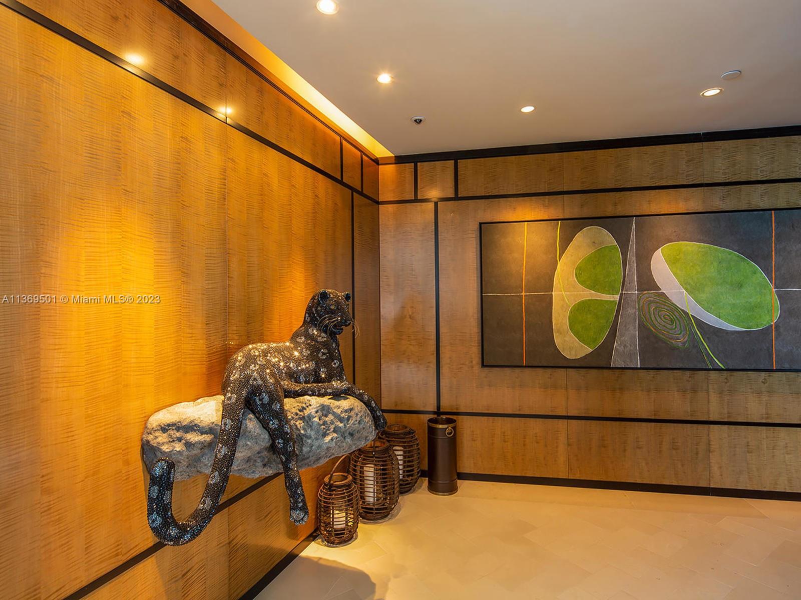 Grand Foyer entry with framed imported Italian wood wall panels