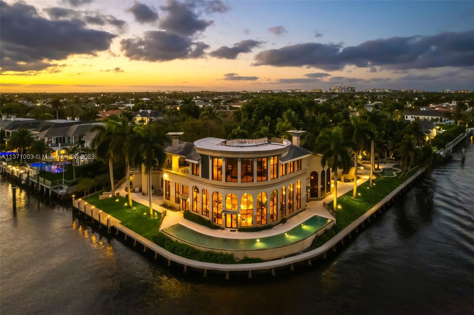 Once in a generation opportunity to own over an acre of waterfront land in the prestigious Royal Palm Yacht & Country Club. For a savvy buyer to build a WF retreat w/ endless design opportunities. SE facing corner lot; 437’ of WF overlooking the Intracoastal Waterway; vacant 0.4-acre lot across the street. The Parker Estate, designed by celebrated architect Mitch Kunik, draws inspiration from tropical resort living & balances luxury, nature, & privacy. Features a 10,000 SF main house & separate guest house resembling bungalows at Little Palm Island resort. The outdoor area features 2 pools, covered patio, surrounded by beautifully landscaped grounds designed by horticulturist Craig Morell. Own one of South Florida's most remarkable homes, steeped in history & unmatched in location.