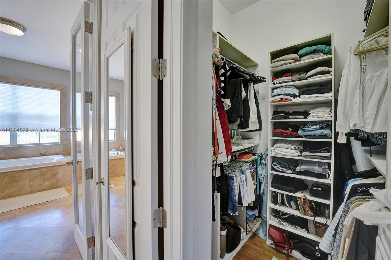 ONE OF 2 WALK-IN CLOSETS