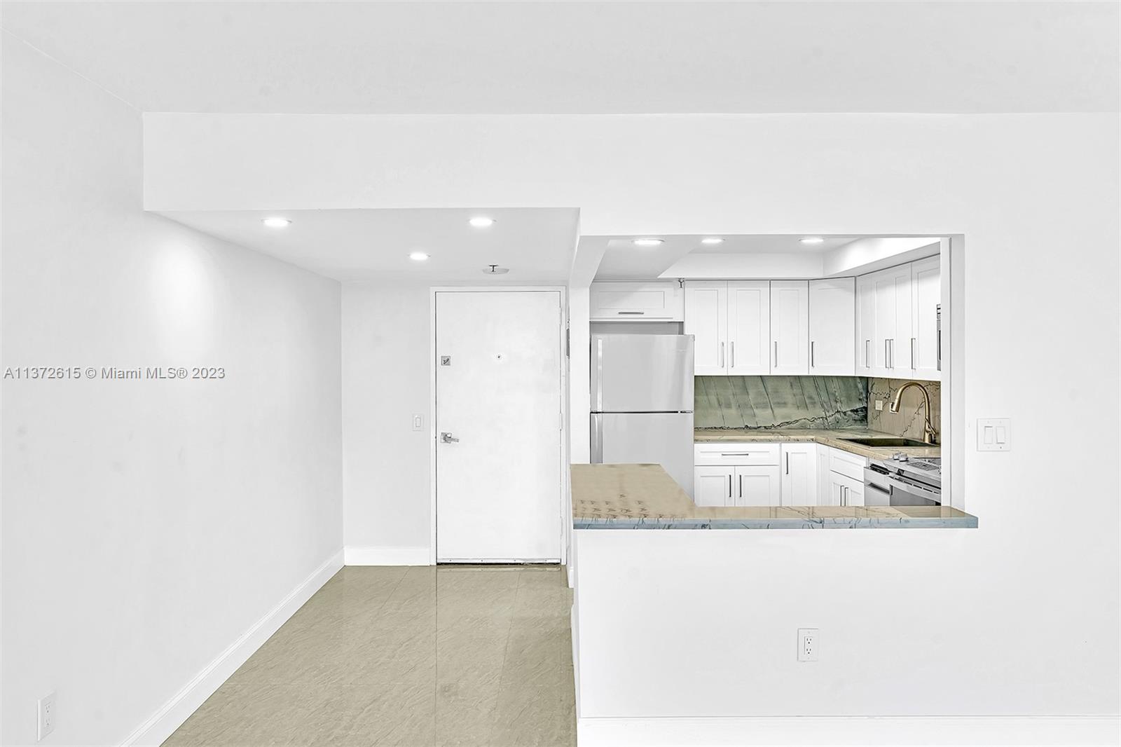 Beautifully Remodeled, Open Kitchen with Quartz countertops.