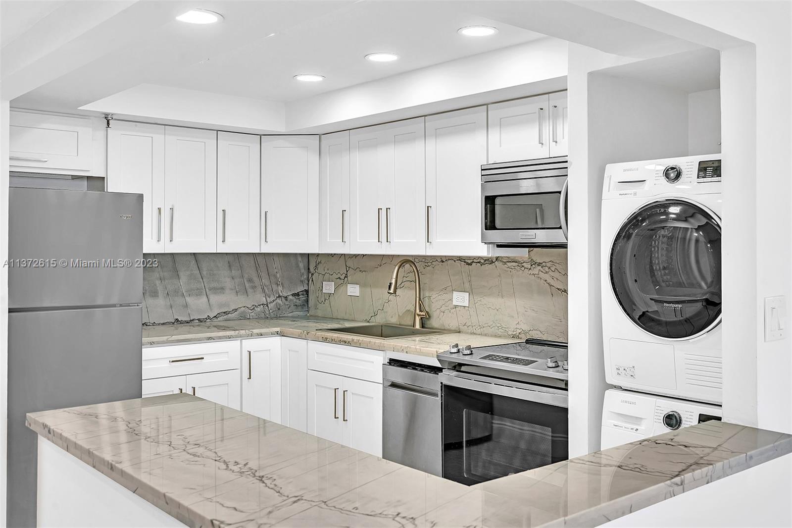Beautifully Remodeled, Open Kitchen with Quartz countertops.