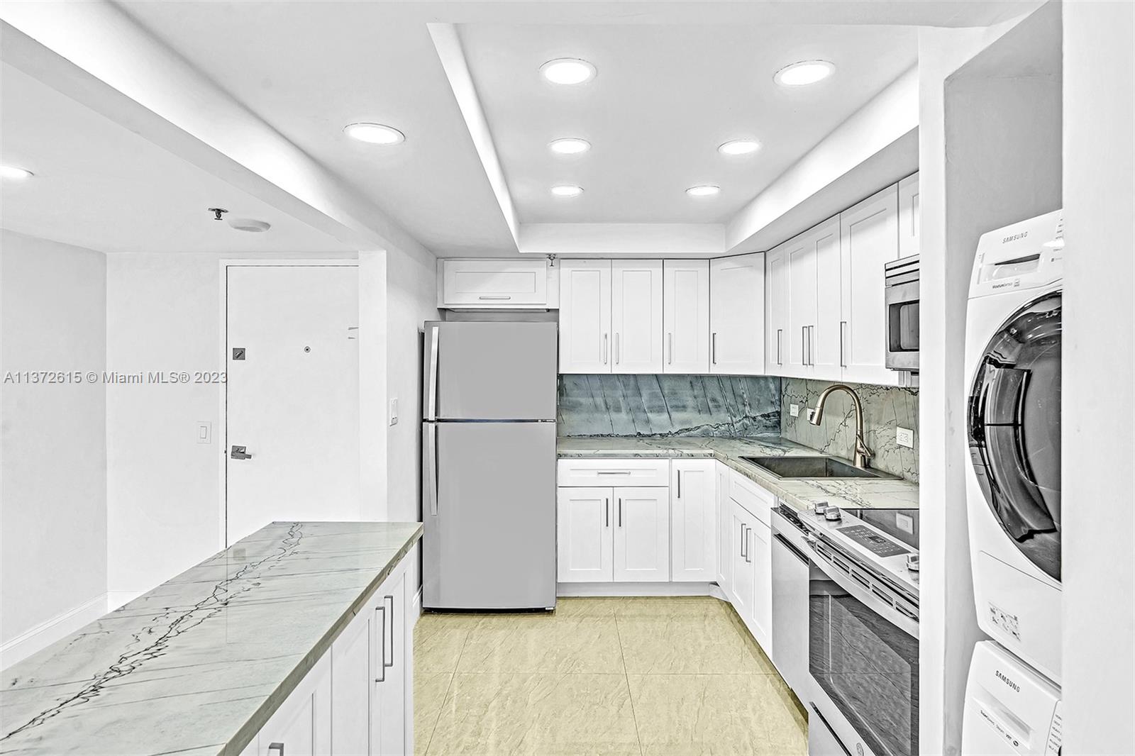 Beautifully Remodeled, Open Kitchen with Quartz countertops.