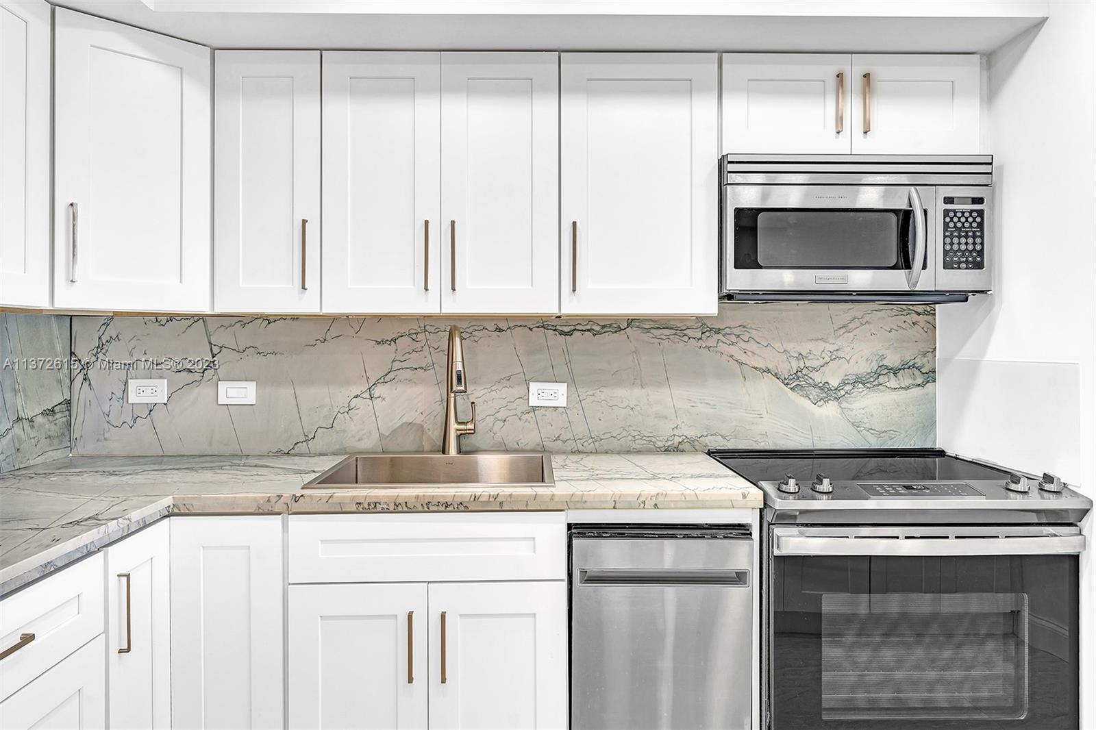 Beautifully Remodeled, Open Kitchen with Quartz countertops.