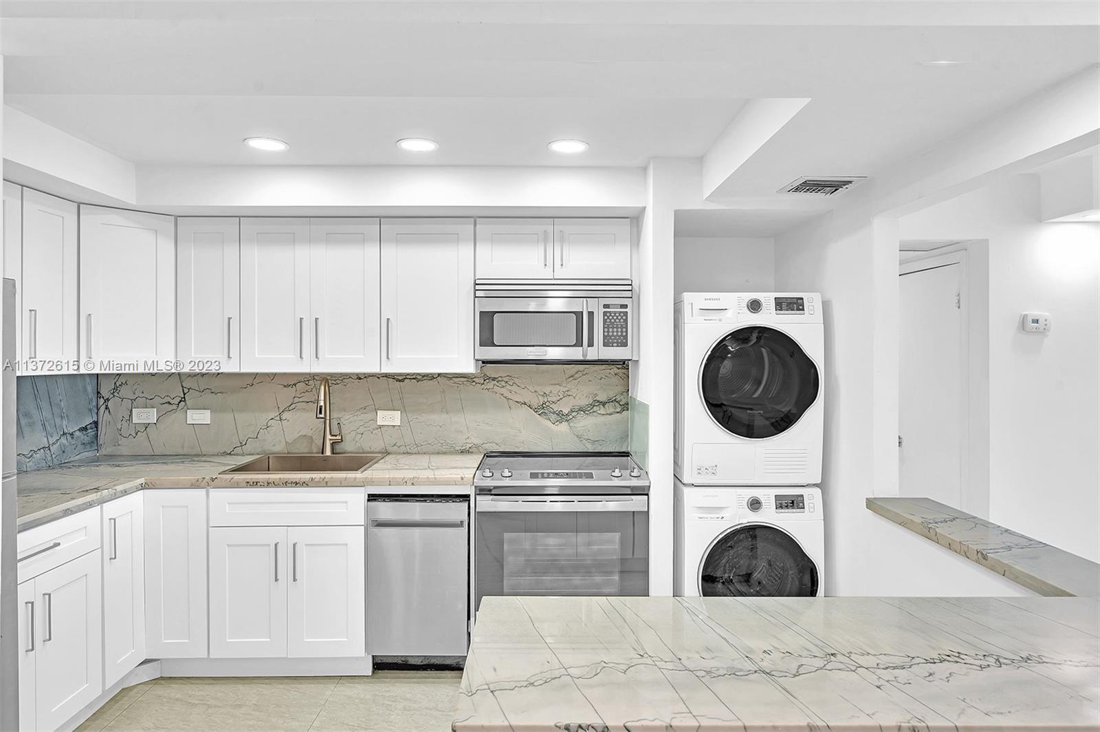 Beautifully Remodeled, Open Kitchen with Quartz countertops.