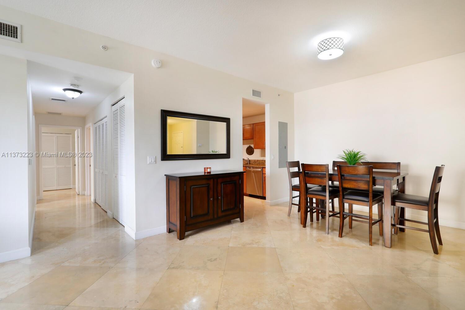 Dining Room with hallway to the left, and kitchen to the left