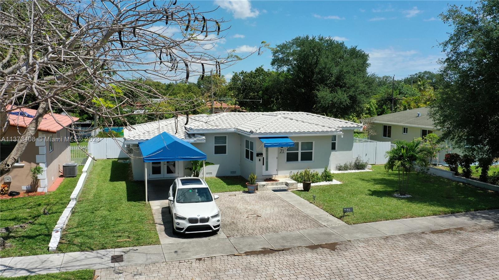 Charming 3/2 home with 1,580 sqft actual area in a quiet low traffic street with quick access to highways just steps away from Barry University in a thriving neighborhood. A spacious living room with abundant natural lightroom that leads to the large and peaceful backyard with space to build a swimming pool or guest house. In this split floor plan,you find two bedrooms that share a beautifully designed bathroom on one side and on the other, a private separate bedroom and bathroom. Modern kitchen with ample cabinets with stainless steel appliances and nice tile floors throughout. The home comes fully equipped with a ring security system, new hurricane-impact windows, and a utility room with a washer and dryer. Come see it for yourself and fall in love with your next home. No flooding zone!