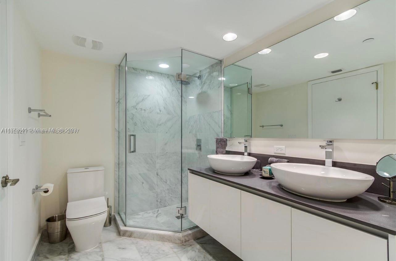 Enclosed shower & dual sinks