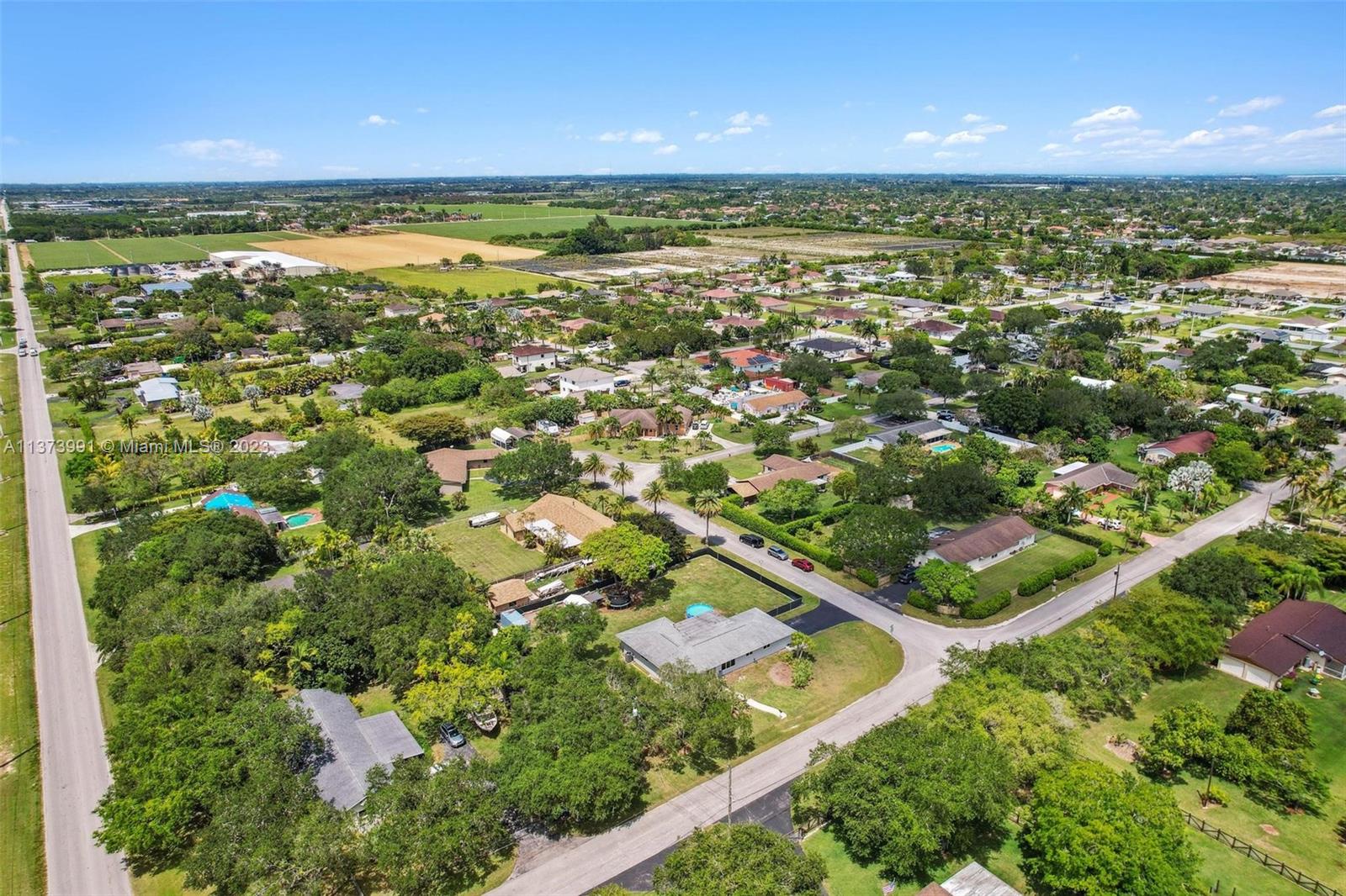 property with blue circular above ground pool/ corner lot