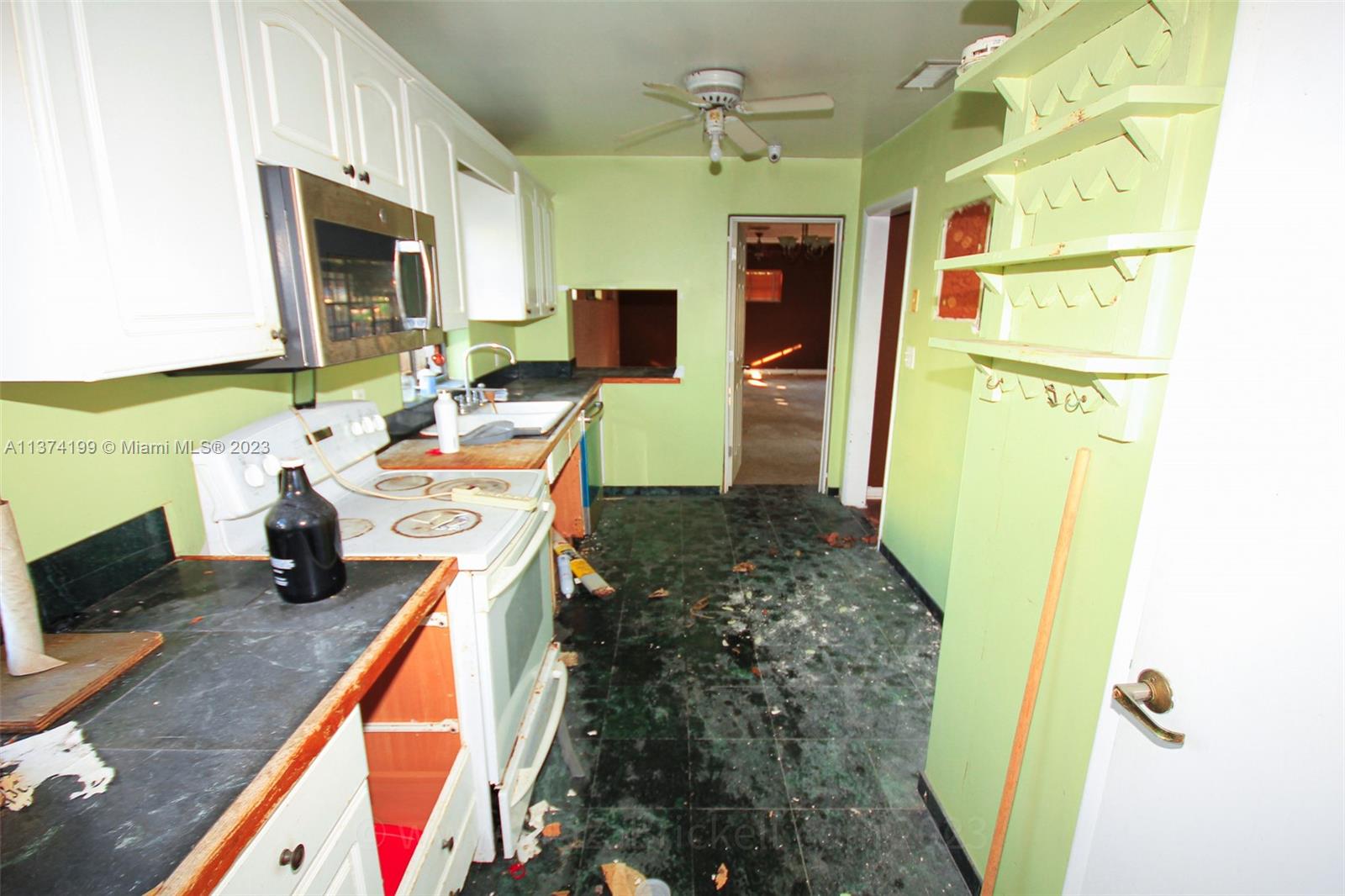 The entire wall to the right will be demolished to open the kitchen and have a central island