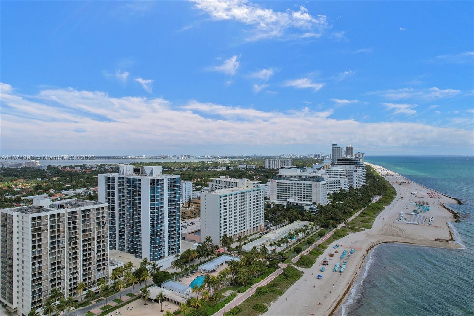 With view of large Pool area in Gardens leading to Beachwalk & sand