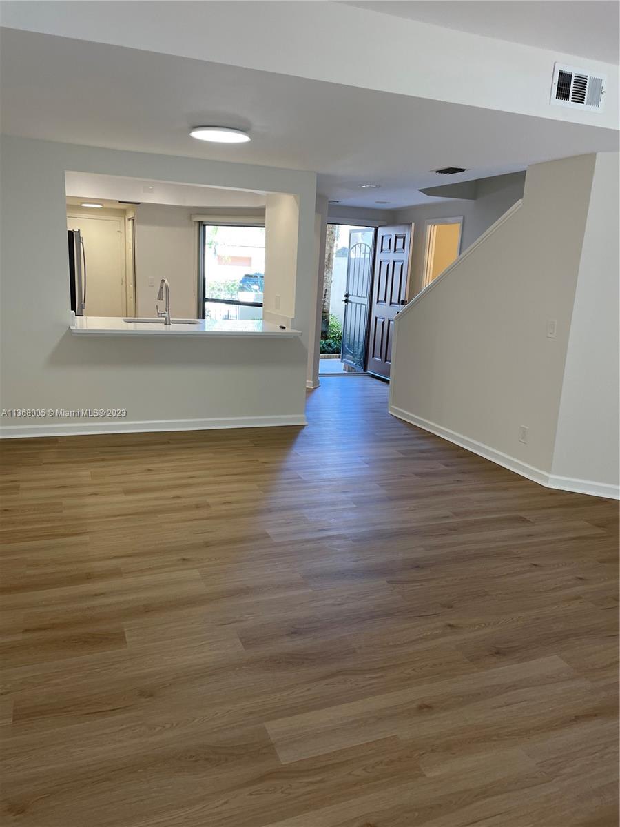 View to kitchen and front door from living room